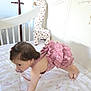 Camila joined the competition — help win amazing prizes! baby, infant, crawling, crib, mattress, pink_clothing, frills, plush_toy, giraffe, nursery, child, indoors, cute, young_child, person, soft_toy, bedroom, decor, sleeping_area, toddler