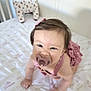 Camila joined the competition — help win amazing prizes! baby, pacifier, crib, crawling, plush_toy, giraffe, mattress, nursery, child, infant, pink_clothing, toy, bed, soft_toy, cute, childrens_room, person, indoor, smiling, headband