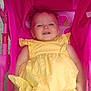 baby, child, yellow_dress, pink_stroller, smile, happy, infant, outdoor, seat, toy, cute, person, sunlight, cheerful, baby_clothing, strawberry_pattern, baby_toy, relaxing, portrait, playful