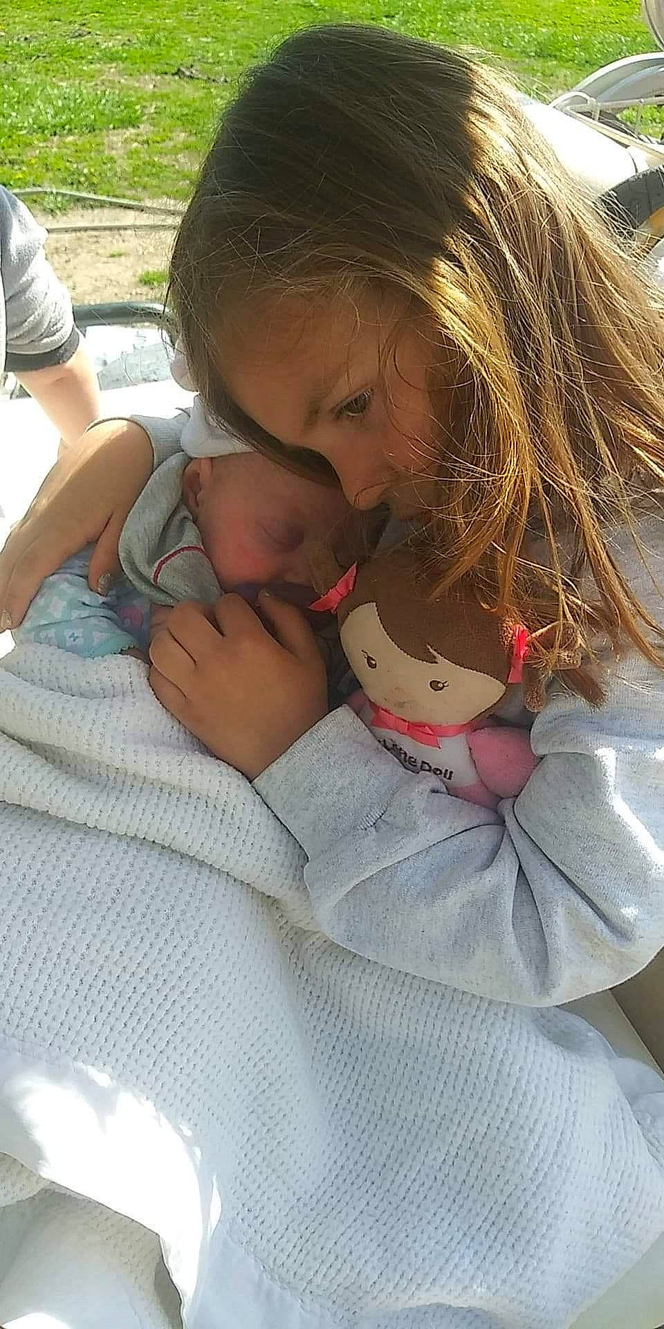 April is registered to the contest to win money with this photo: child, gesture, hug, person