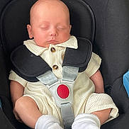 Maxwell joined the competition — help win amazing prizes! baby, infant, car_seat, sleeping, child, white_socks, cream_outfit, harness, red_button, peaceful, cute, resting, indoors, seatbelt, small_child, portrait, head, legs, hands, comfort