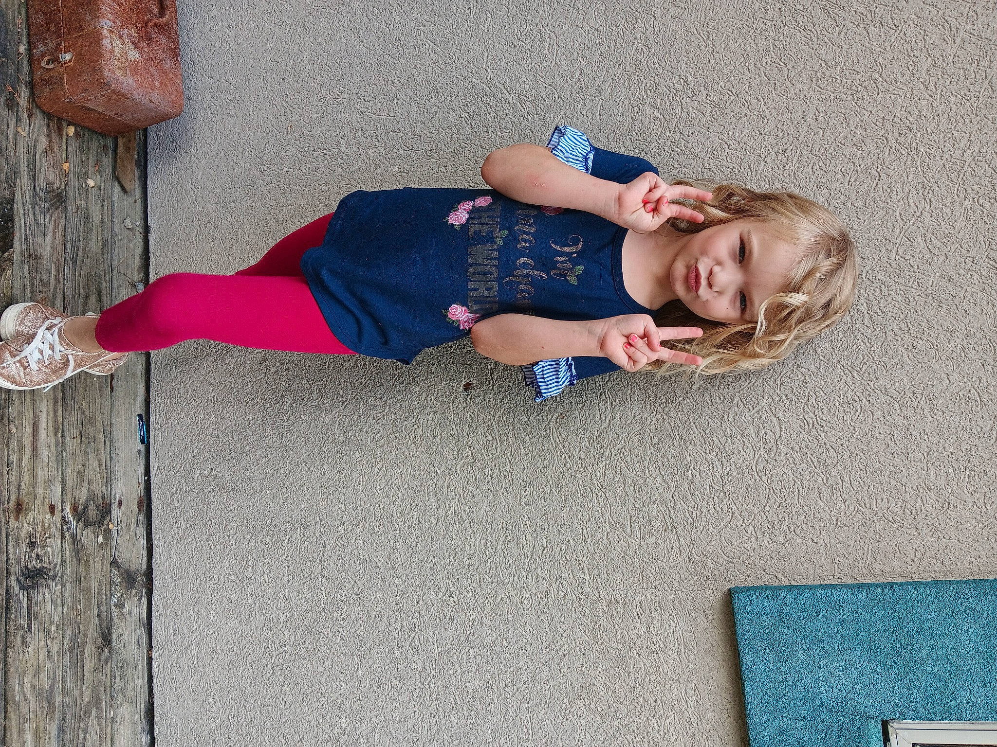 Kensley joined the competition — help win amazing prizes! baby_toddler_clothing, child, dress, electric_blue, floor, flooring, foot, fun, human_leg, knee, leisure, pattern, person, sandal, sidewalk, sitting, smile, thigh, toddler, tree