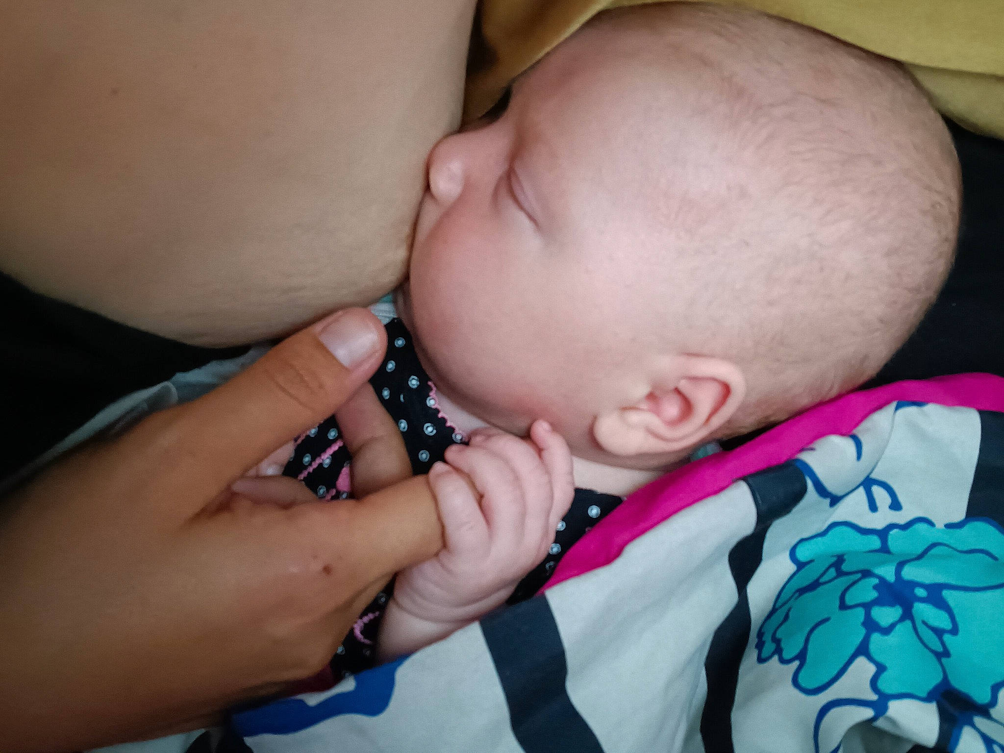 Ariel is registered to the contest to win money with this photo: baby, baby_toddler_clothing, cheek, child, comfort, eye, eyelash, finger, gesture, hand, happy, lip, mouth, nail, nose, pattern, person, pink, skin, thumb