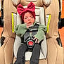 Hadley is registered to the contest to win money with this photo: baby, car_seat, pacifier, headband, red_bow, green_sweater, black_tights, infant, child, seatbelt, evenflo, indoor, wood_floor, clothing, hands, face, human, person, baby_girl, sitting