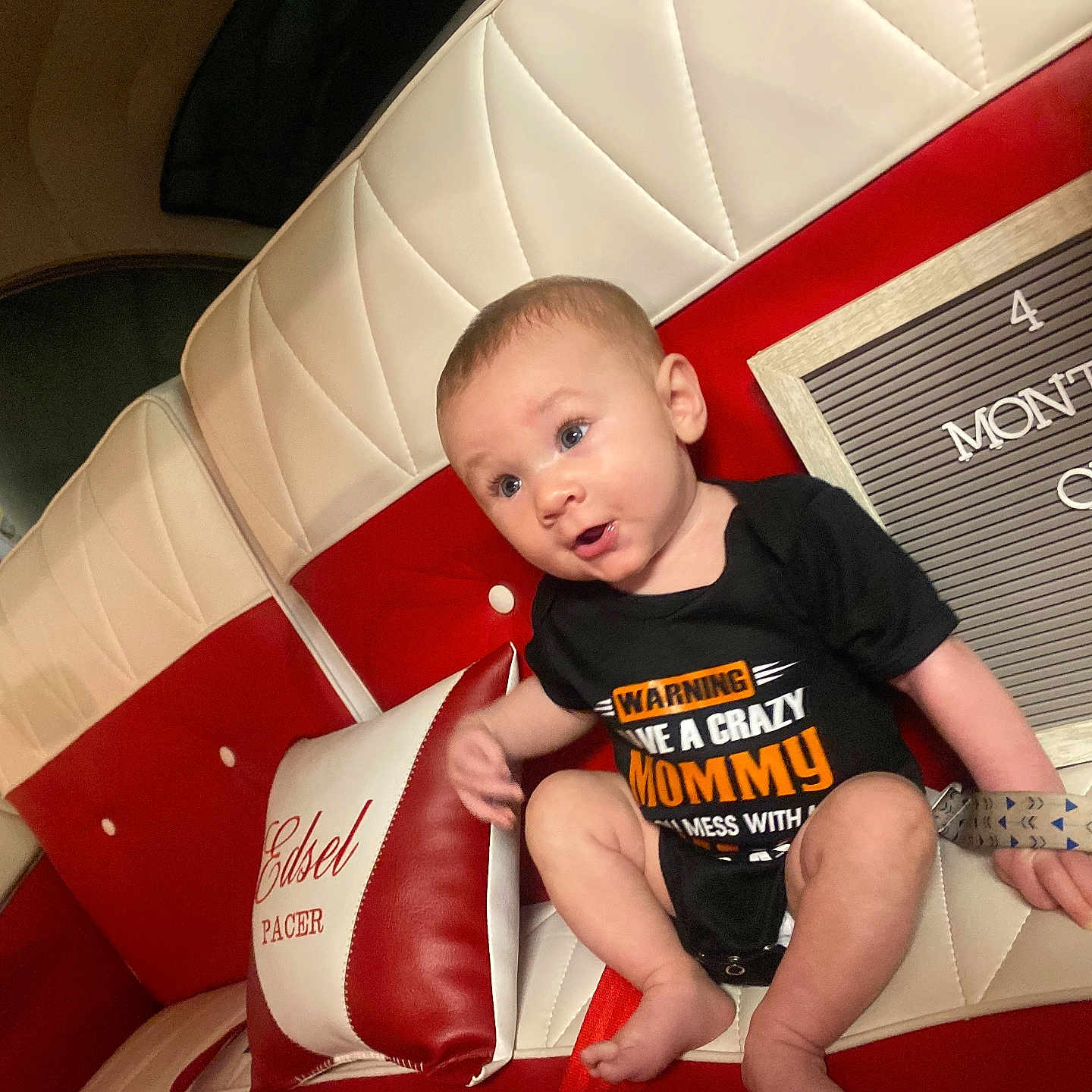 Preston is registered to the contest to win money with this photo: architecture, baby, bodypart, building, clothing, couch, cushion, face, finger, furniture, hand, head, homedecor, indoors, person, photography, portrait, shorts, sitting, t_shirt