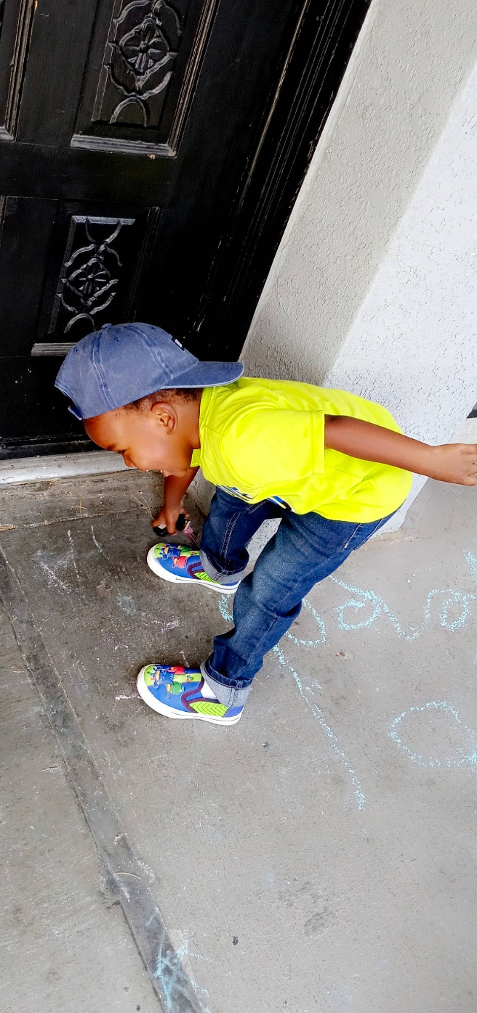 He'Zekiah is registered to the contest to win money with this photo: asphalt, baseball_cap, cap, child, concrete, denim, electric_blue, flooring, fun, hat, jeans, leisure, outdoor_shoe, person, road_surface, shoe, sidewalk, sneakers, t_shirt, walking_shoe