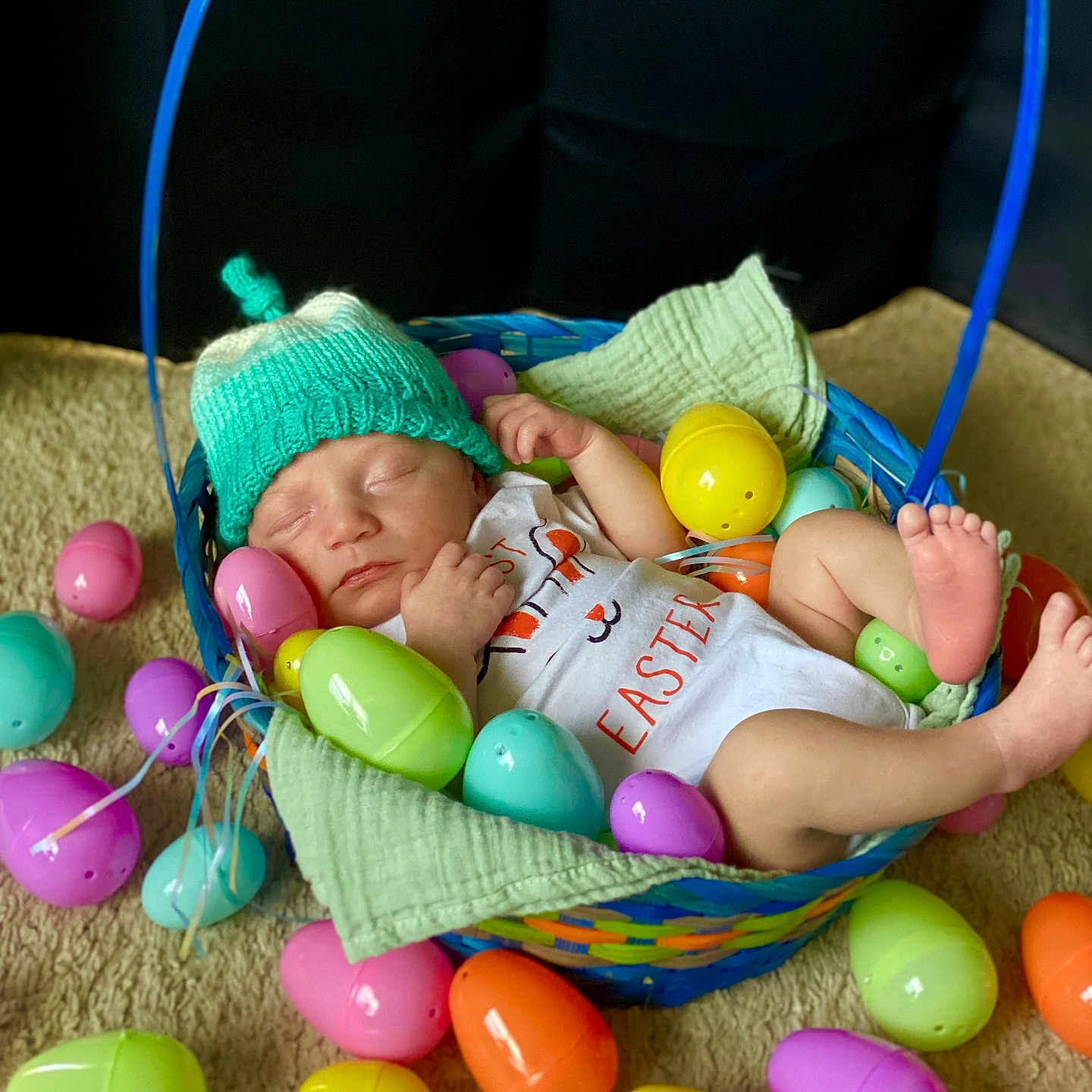 Asher joined the competition — help win amazing prizes! baby, blanket, carpet, child, clothing, colorful, cozy, cute, easter_basket, easter_eggs, festive, foot, hand, holiday, indoors, infant, knitted_hat, newborn, plastic_eggs, sleeping