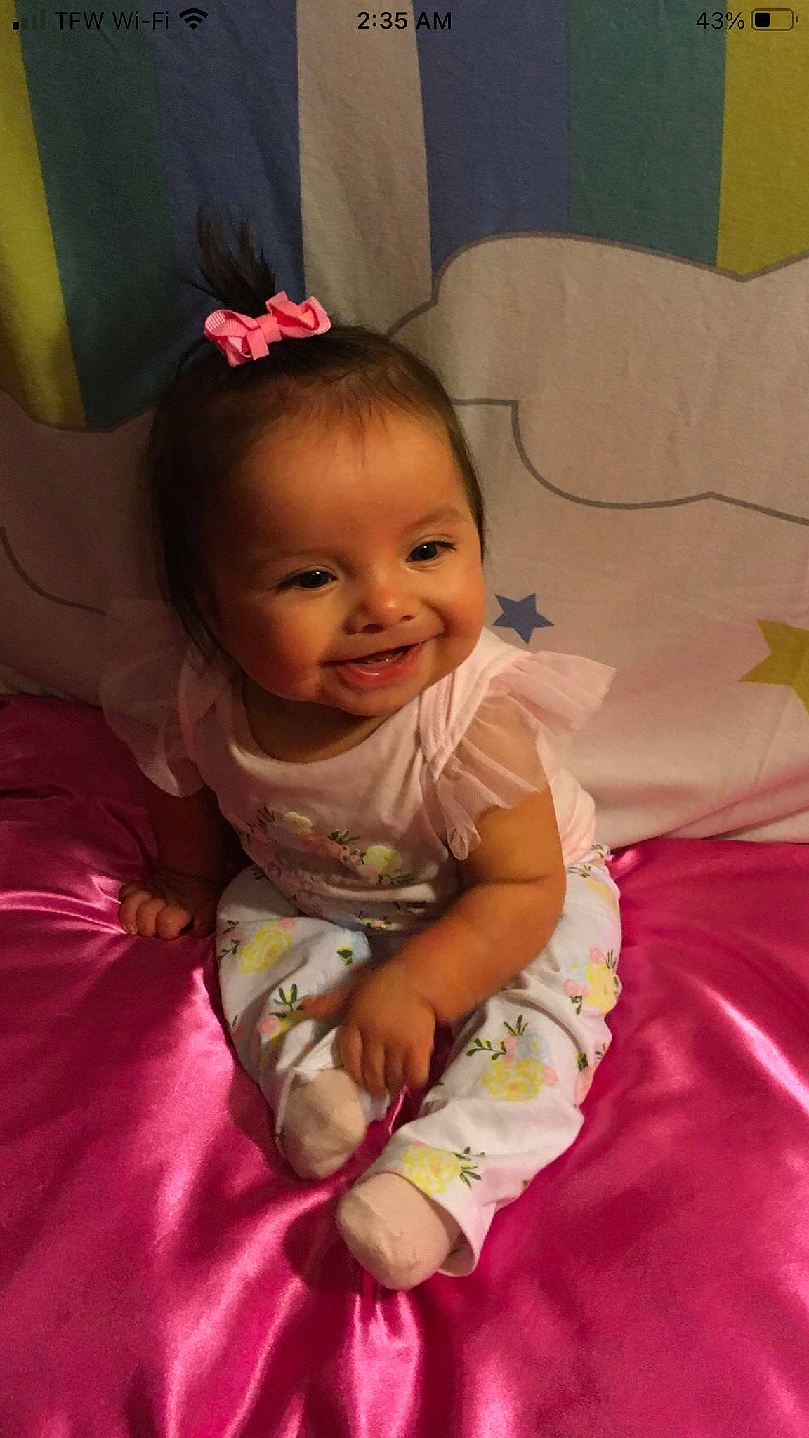 Sky is registered to the contest to win money with this photo: baby, baby_products, baby_toddler_clothing, cheek, child, comfort, dress, eye, fun, happy, iris, joy, lip, magenta, person, pink, product, purple, sitting, skin