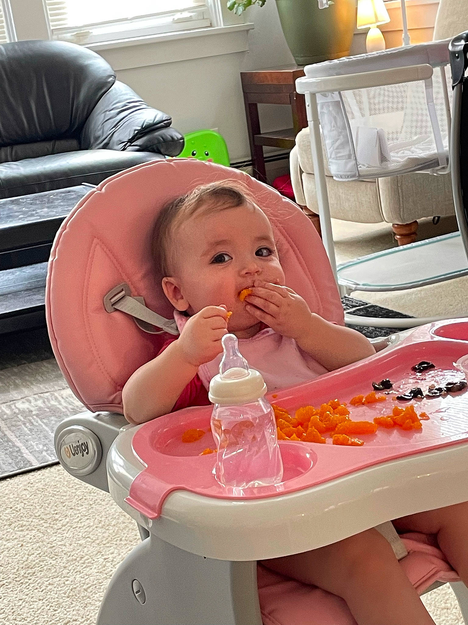 Ellie joined the competition — help win amazing prizes! baby, baby_bottle, baby_products, baby_toddler_clothing, bottle, chair, child, comfort, cooking, drinkware, food, food_craving, lamp, nail, person, plastic_bottle, product, room, sitting, toddler