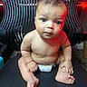 baby, bare_chest, black_chair, chair, curious, cute, diaper, expression, floor, foot, hand, indoors, infant, lighting, plump, portrait, red_light, sitting, skin, young_child