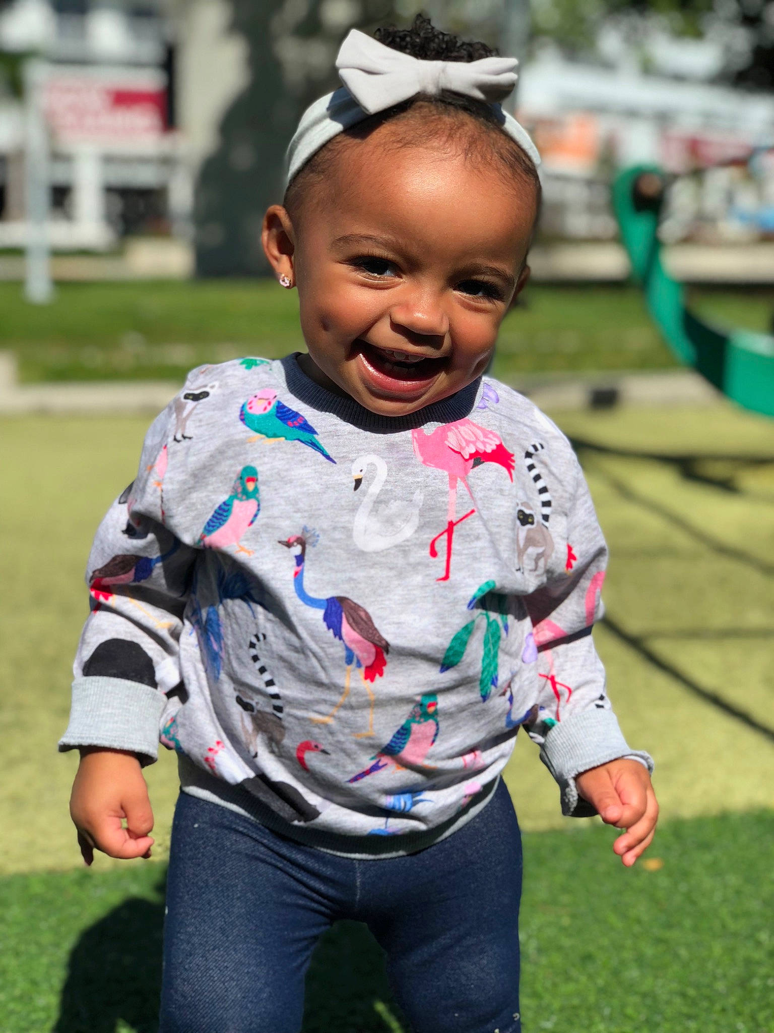 Kehlani is registered to the contest to win money with this photo: child, cool, facial_expression, fun, grass, happy, joy, person, play, smile, toddler