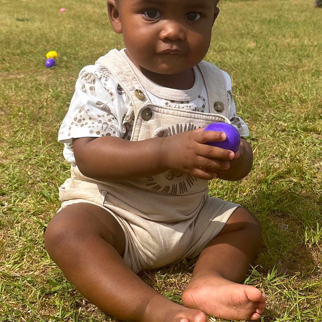 Shakur joined the competition — help win amazing prizes! baby, bodypart, car, clothing, face, finger, grass, hand, head, lawn, nature, outdoors, park, person, photography, plant, portrait, shorts, sitting, transportation