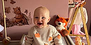Autumn is registered to the contest to win money with this photo: baby, child, smiling, sweater, pumpkin, orange_pants, changing_table, nursery, stuffed_animal, fox_toy, bear_toy, woodland_theme, pink_wall, decor, baby_clothes, happy, indoor, cute, infant, seated