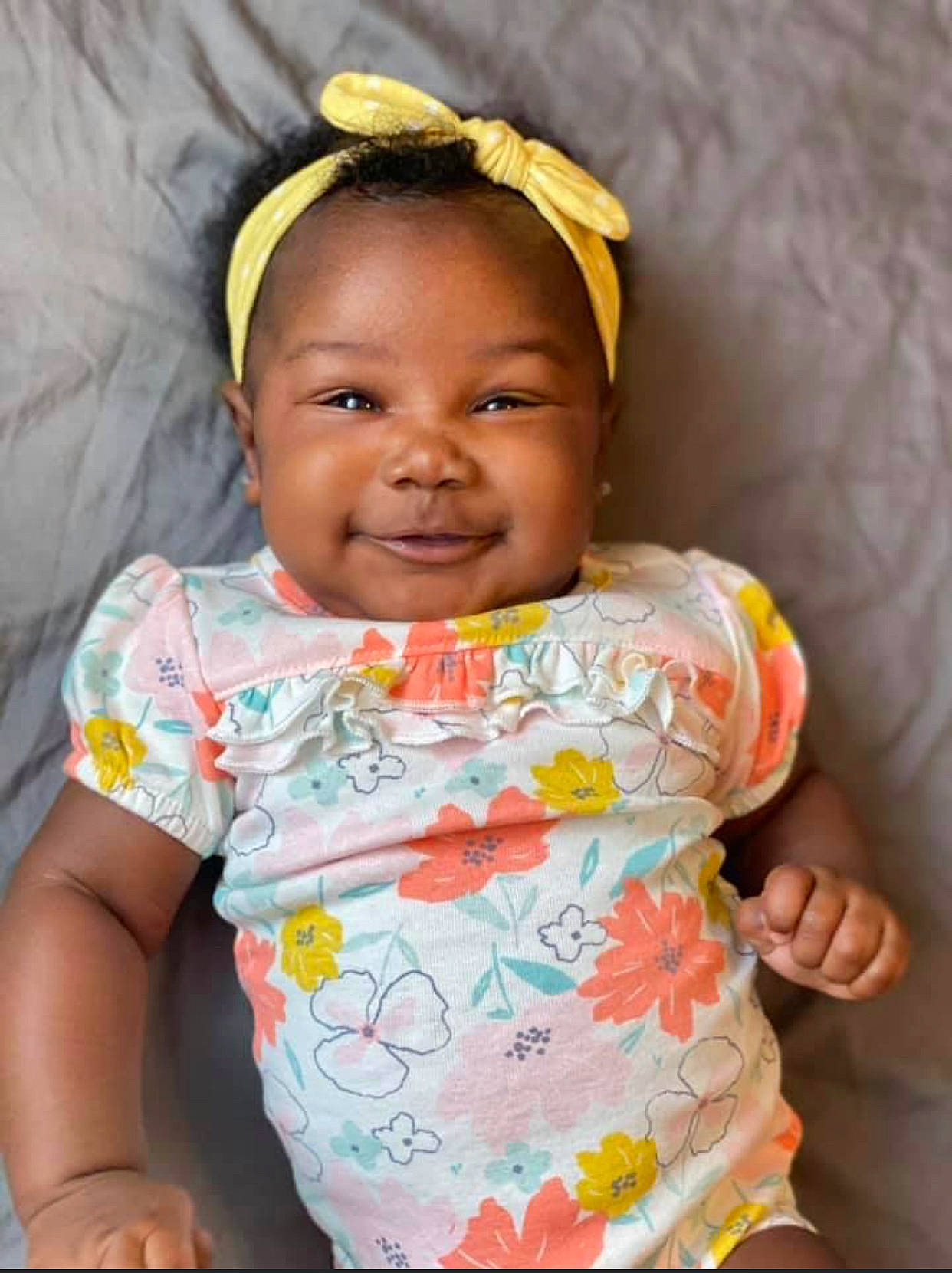 Rhyleigh is registered to the contest to win money with this photo: baby, baby_toddler_clothing, cheek, chin, cool, eyebrow, finger, forehead, happy, iris, joy, lip, mouth, neck, nose, person, pink, skin, sleeve, smile