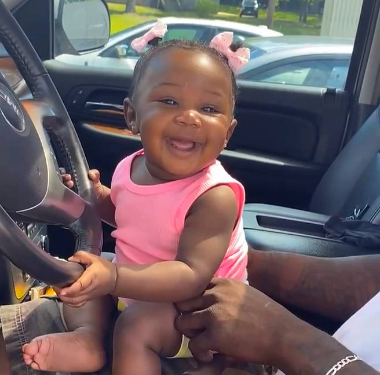 Rhyleigh is registered to the contest to win money with this photo: auto_part, automotive_design, automotive_exterior, car, car_seat, car_seat_cover, cool, happy, head_restraint, joy, land_vehicle, leg, motor_vehicle, person, personal_luxury_car, smile, steering_part, steering_wheel, thigh, toddler