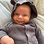 Oakley joined the competition — help win amazing prizes! apparel, baby, bed, blanket, button, child, clothing, cozy, cute, face, hand, hoodie, indoors, infant, knitwear, pocket, portrait, sleeve, smile, young