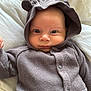 Oakley joined the competition — help win amazing prizes! baby, bed, blanket, blue_eyes, buttoned_clothing, child, cozy, cute, face, hoodie, indoor, infant, knitwear, person, portrait, sleepwear, smile, soft_lighting, warm_clothing, young