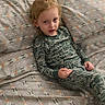 Alijah is registered to the contest to win money with this photo: child, bed, pajamas, patterned_sheets, blonde_hair, indoor, person, sleepwear, curious, resting, young, portrait, home, comfort, cute, casual, relaxed, childhood, smile, cozy