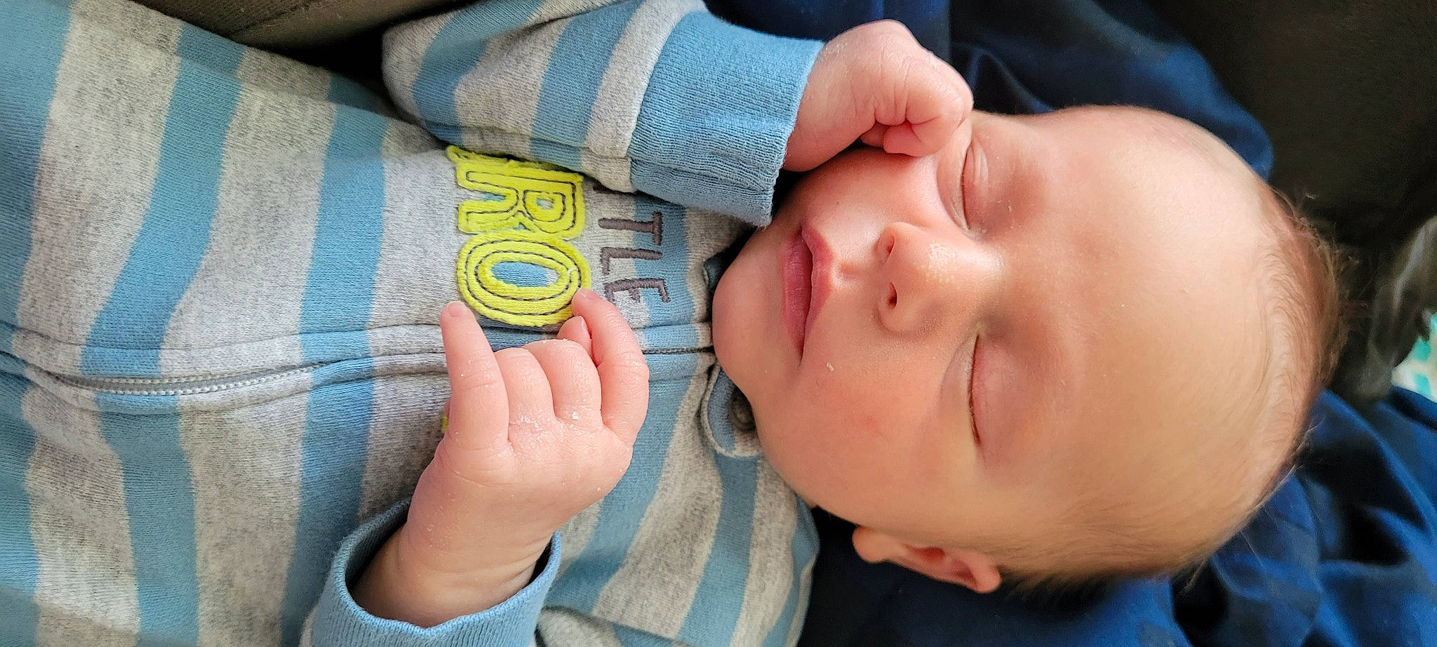 Axel is registered to the contest to win money with this photo: baby, baby_products, baby_toddler_clothing, blue, cheek, child, comfort, ear, eyelash, finger, gesture, hand, mouth, nail, neck, nose, person, skin, sleeve, thumb