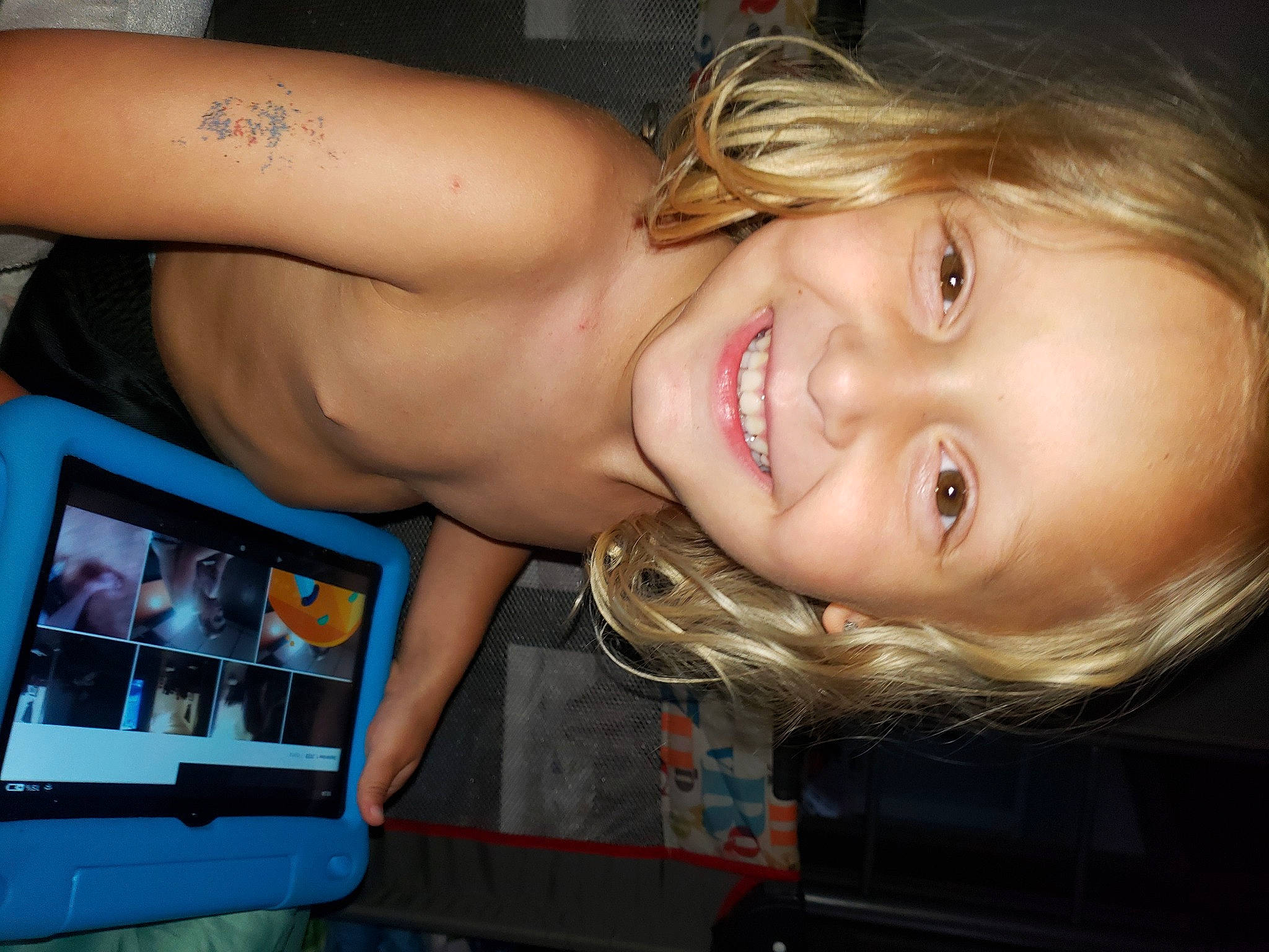 Aiden is registered to the contest to win money with this photo: blond, brown_hair, chest, display_device, earrings, electric_blue, eyelash, flash_photography, fun, gadget, happy, human_leg, jaw, jewellery, joy, laugh, leisure, lip, muscle, person