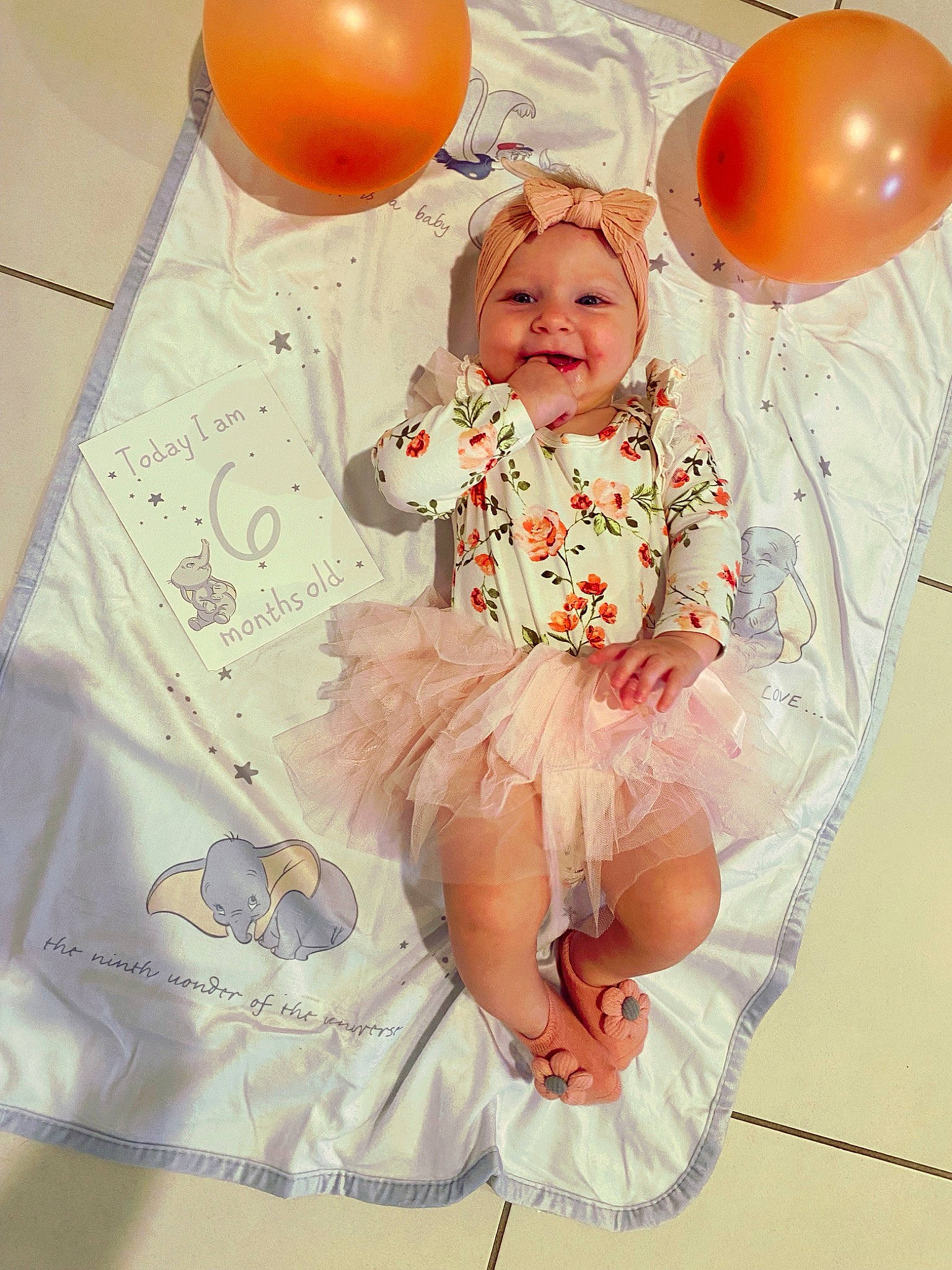 Alora is registered to the contest to win money with this photo: baby_toddler_clothing, balloon, child, day_dress, dress, embellishment, event, fun, happy, headwear, joy, magenta, party, party_supply, pattern, peach, person, pink, room, ruffle