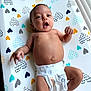 Luna joined the competition — help win amazing prizes! baby, infant, diaper, changing_pad, heart_pattern, lying_down, cute, expression, skin, arm, leg, hand, face, mouth_open, indoor, newborn, child, playful, adorable, colorful