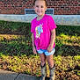 child, clothing, face, female, footwear, girl, grass, head, nature, outdoors, person, photography, plant, portrait, shoe, shorts, sleeve, standing, t_shirt, yard