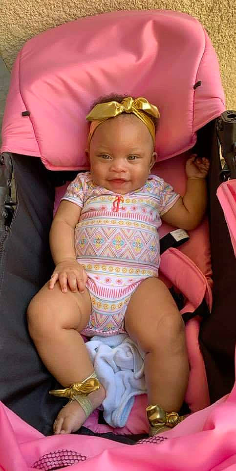 Aabree Louise is registered to the contest to win money with this photo: baby, car_seat, cheek, child, daughter, person, pink, product, sitting, thigh, toddler