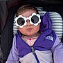 Olivia is registered to the contest to win money with this photo: baby, infant, child, sunglasses, flower_shaped_glasses, stroller, car_seat, purple_fleece, jacket, zipper, face, cheeks, pout, hair, hands, portrait, clothing, accessory, seat_pad, hood