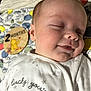 Theo joined the competition — help win amazing prizes! baby, sleeping, infant, onesie, white_clothing, milestone_marker, 2_months, blanket, patterned_blanket, cute, peaceful, face, close_up, child, newborn, resting, soft_lighting, indoors, portrait, smiling