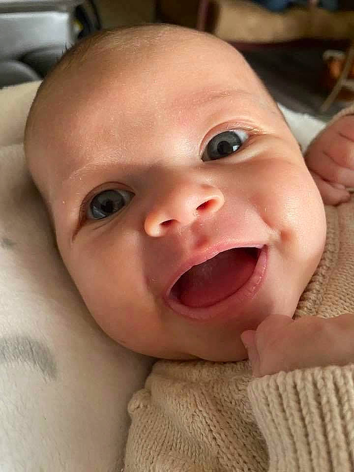 Kora is registered to the contest to win money with this photo: baby, cheek, chin, eye, eyebrow, eyelash, face, facial_expression, gesture, happy, iris, lip, mouth, nose, person, skin, smile, toddler, tongue, tooth