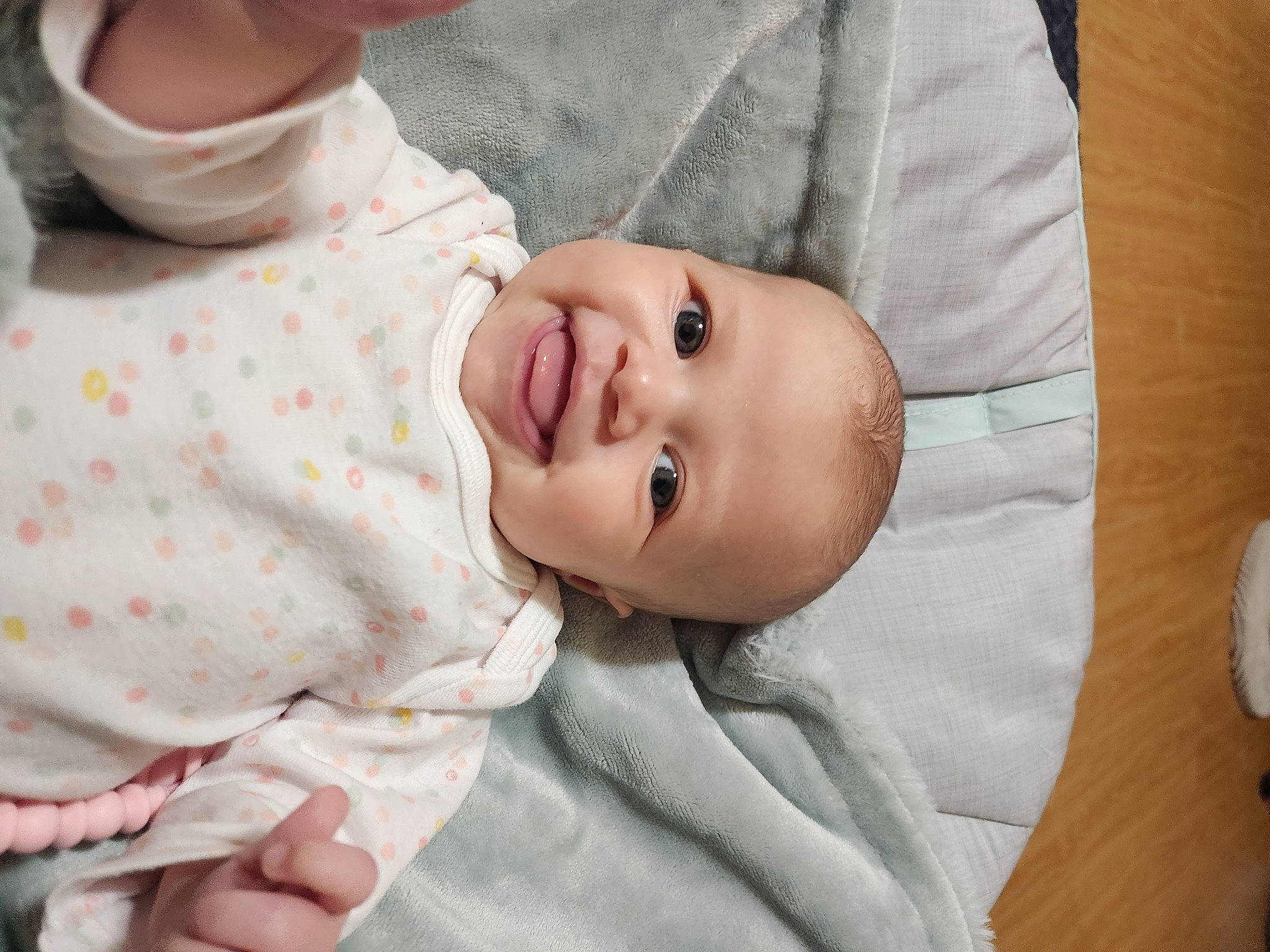 Kora is registered to the contest to win money with this photo: baby, baby_products, baby_safety, baby_toddler_clothing, cheek, child, comfort, eyelash, happy, hat, linens, lip, nose, pattern, person, portrait_photography, room, skin, sleeve, smile