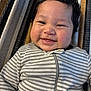 baby, smiling, face, striped_onesie, cheeks, hair, blanket, texture, child, infant, cute, happy, portrait, indoors, closeup, clothing, person, young, playful, relaxing