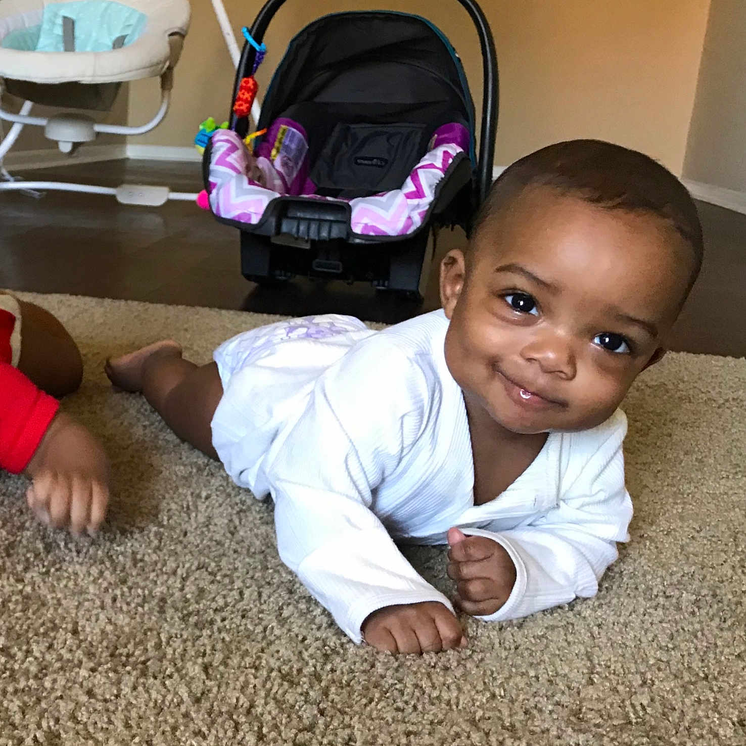 Amya joined the competition — help win amazing prizes! baby, child, electronic_device, floor, flooring, fun, person, play, product, sitting, technology, toddler