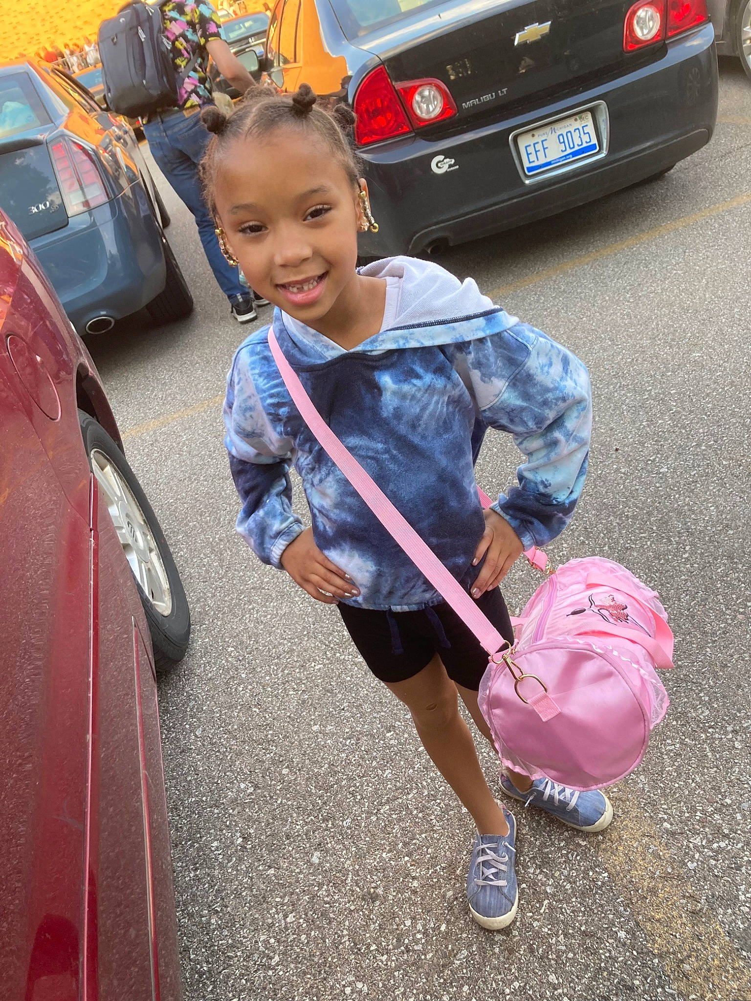 Ivory is registered to the contest to win money with this photo: automotive_design, automotive_exterior, automotive_lighting, automotive_tire, bumper, car, footwear, hood, joy, mode_of_transport, motor_vehicle, person, shoe, smile, sneakers, tire, toddler, travel, trunk, vehicle