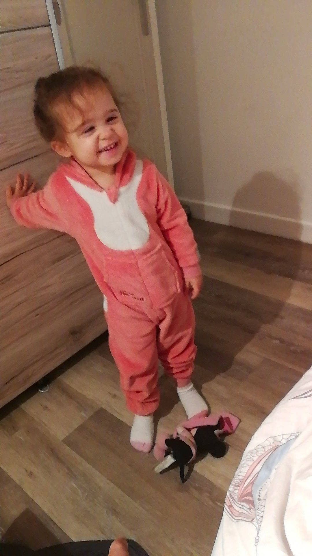 Léna Rose participe au concours pour gagner de l'argent avec cette photo : baby, cheek, child, floor, flooring, footwear, hardwood, joy, leg, outerwear, person, pink, play, shoe, smile, standing, toddler, wood, wood_flooring