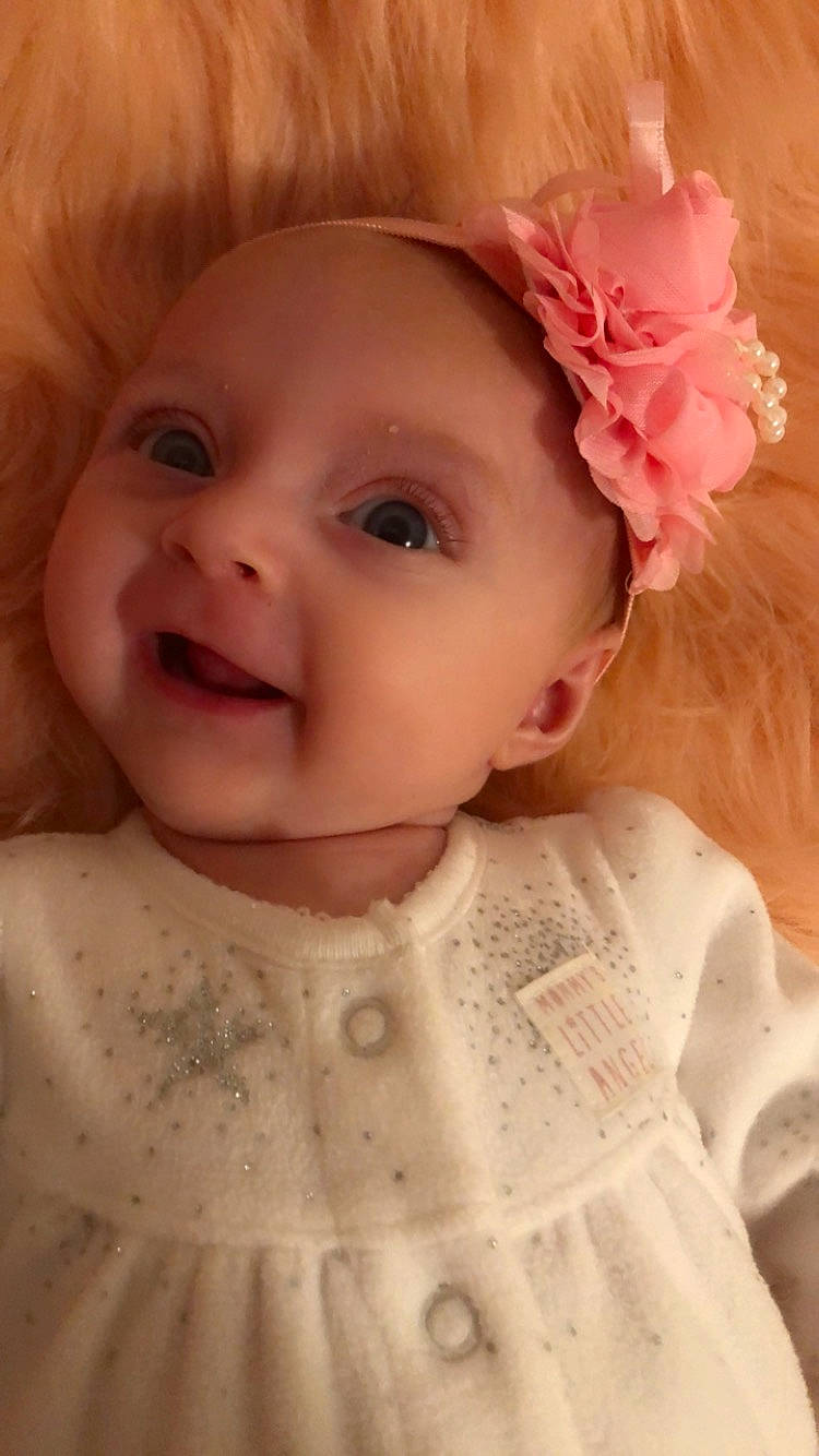 Daisy joined the competition — help win amazing prizes! baby_toddler_clothing, cheek, chin, dress, eye, eyebrow, eyelash, face, facial_expression, hair, hairstyle, happy, head, iris, lip, organ, person, skin, sleeve, smile