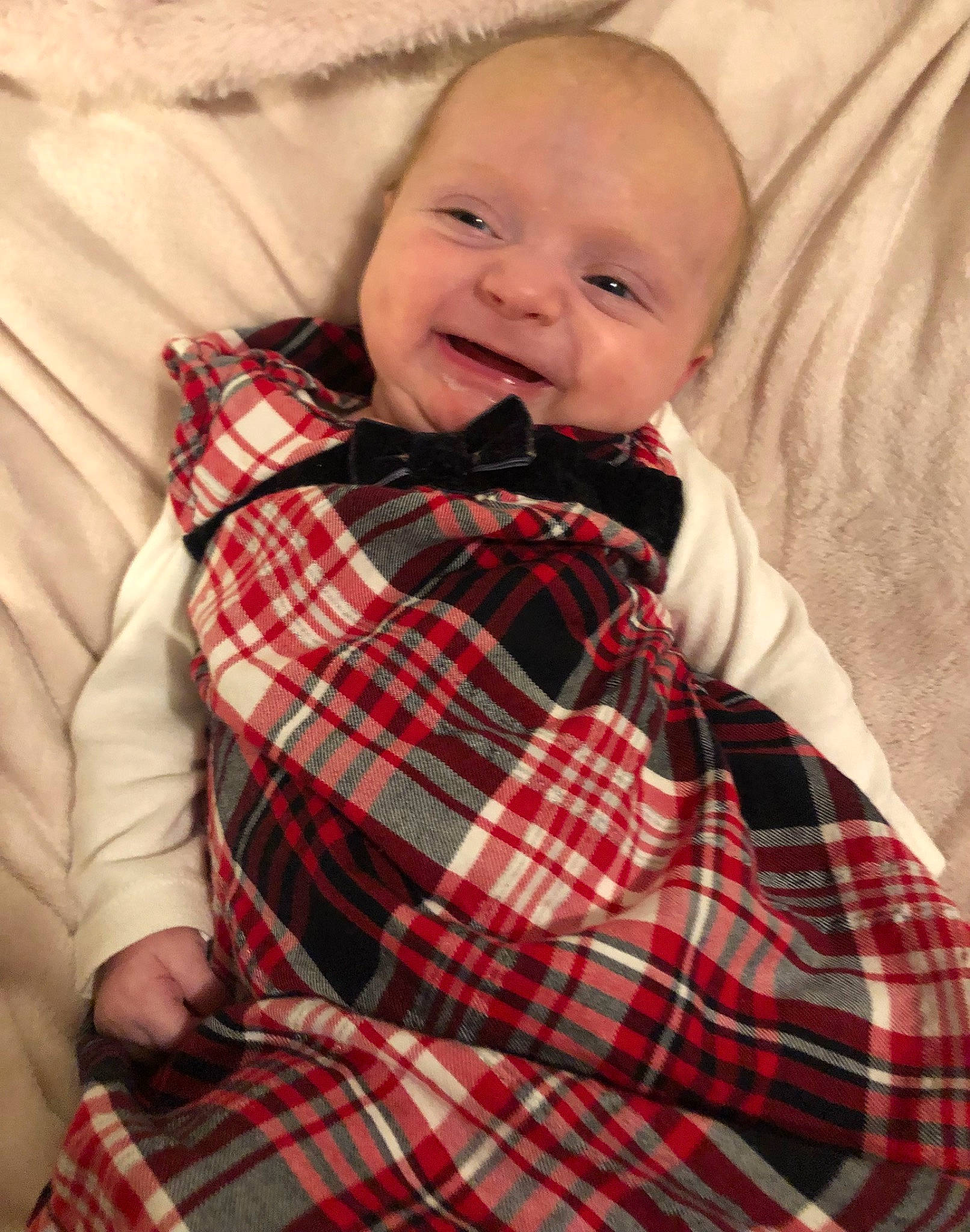 Daisy is registered to the contest to win money with this photo: baby, baby_toddler_clothing, child, collar, comfort, dress_shirt, happy, linens, pattern, person, plaid, sitting, sleeve, smile, t_shirt, tartan, textile, toddler