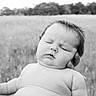 Henry joined the competition — help win amazing prizes! baby, infant, face, chubby, sleeping, outdoor, hand, black_and_white, portrait, peaceful, skin, head, arm, nature, grass, person, closeup, soft, expression, newborn