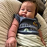 Henry joined the competition — help win amazing prizes! baby, infant, child, cute, chubby_cheeks, blue_shirt, striped_blanket, pillow, relaxed, indoor, home, person, portrait, young_child, sleepwear, comfort, cozy, soft_lighting, couch, curious