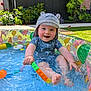 toddler, child, pool, water, splashing, hat, swimsuit, toy, outdoor, garden, plants, summer, play, happy, smiling, barefoot, blue, inflatable_pool, sunlight, fun