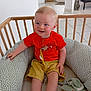 Albin participe au concours pour gagner de l'argent avec cette photo : toddler, child, baby_nest, red_shirt, yellow_shorts, blue_eyes, soft_toys, wooden_baby_bed, indoor, home, floor_tiles, happy, smiling, sitting, cute, person, infant, cozy, playtime, casual_clothing