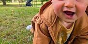 Albin participe au concours pour gagner de l'argent avec cette photo : baby, child, smiling, crawling, grass, outdoor, park, jacket, blue_eyes, happy, face, person, nature, greenery, hoodie, infant, cute, young_child, daylight, casual
