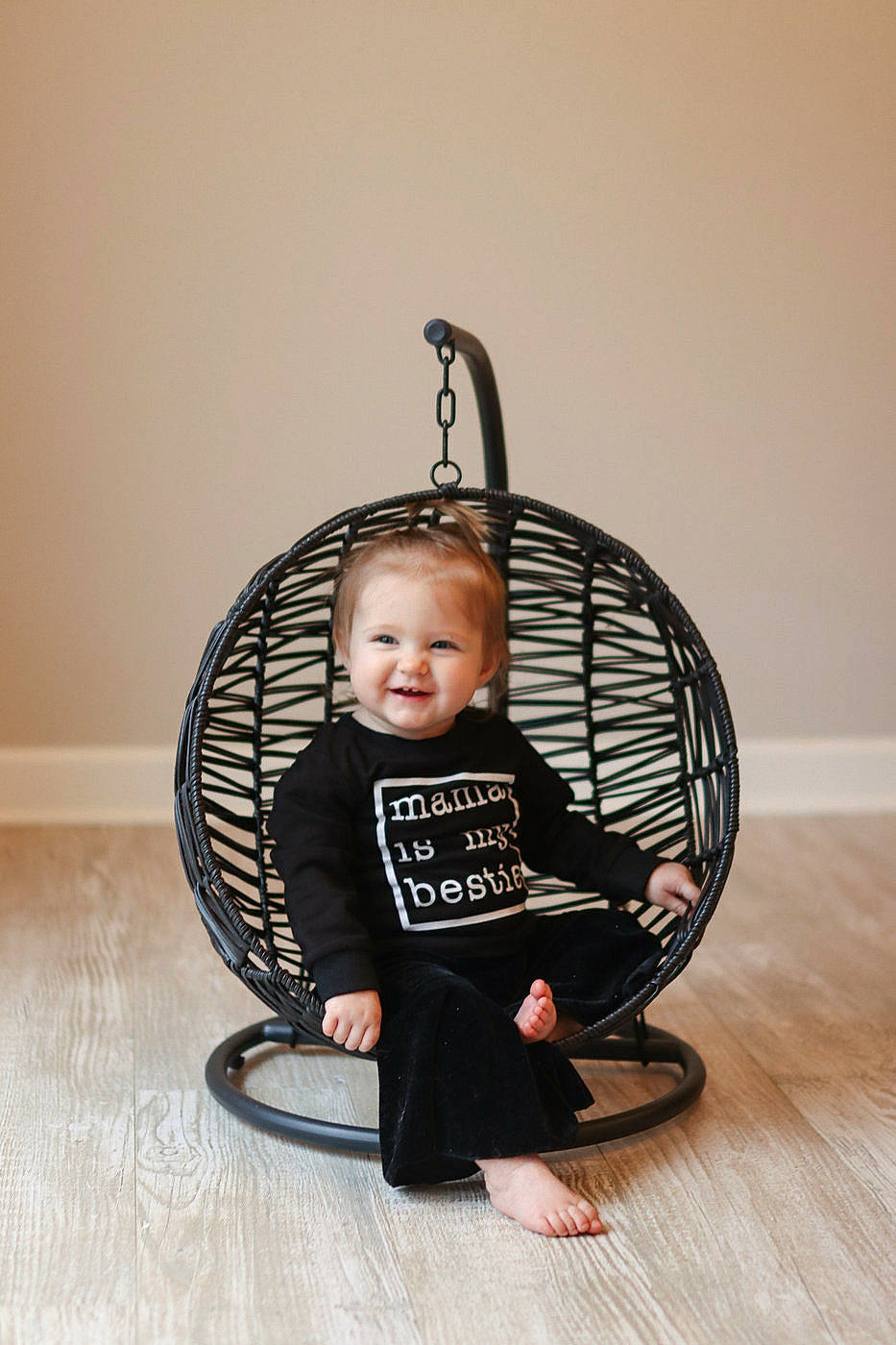 Gracelyn is registered to the contest to win money with this photo: baby, baby_products, baby_toddler_clothing, chair, child, circle, comfort, fashion_accessory, flooring, hardwood, headgear, joy, metal, person, room, sandal, sitting, smile, tire, toddler