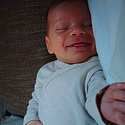 Ange participe au concours pour gagner de l'argent avec cette photo : baby, blanket, child, clothing, comfort, couch, cozy, cute, hand, happy, indoors, infant, peaceful, pillow, portrait, resting, sleeping, smile, soft, young
