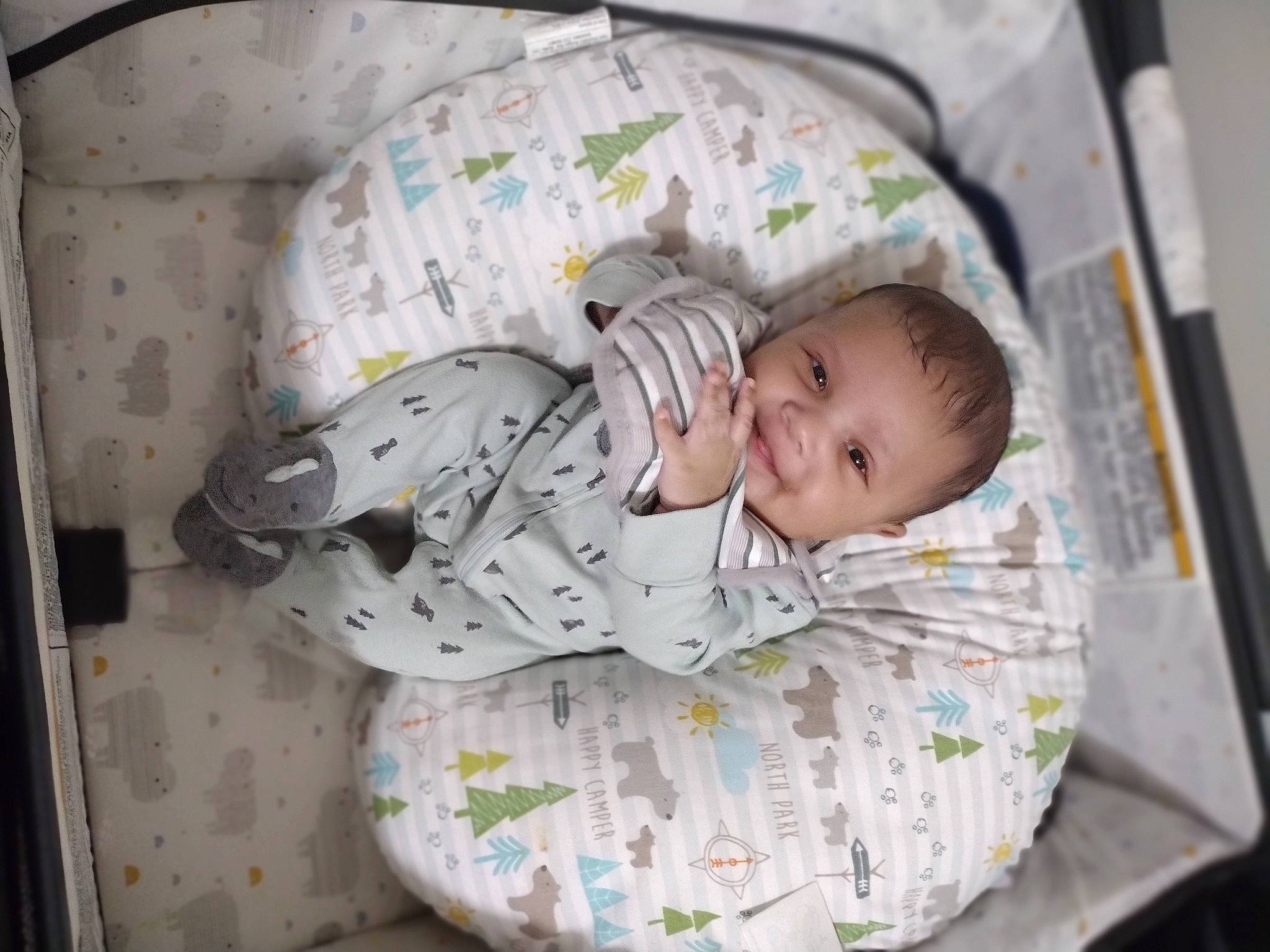 Trenton Jr is registered to the contest to win money with this photo: baby, baby_products, baby_safety, baby_toddler_clothing, bedtime, child, comfort, event, facial_expression, joy, linens, nap, pattern, person, room, sitting, sleep, sleeve, smile, toddler