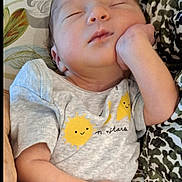 Kaylee is registered to the contest to win money with this photo: baby, sleeping, infant, onesie, clothing, hand, face, peaceful, cute, newborn, pattern, fabric, resting, child, portrait, soft, skin, indoors, comfort, relaxation