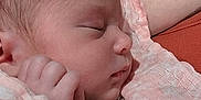 Kaylee is registered to the contest to win money with this photo: baby, newborn, sleeping, blanket, arm, skin, closeup, peaceful, infant, person, soft, cute, child, rest, tender, face, hand, wrapped, cozy, portrait