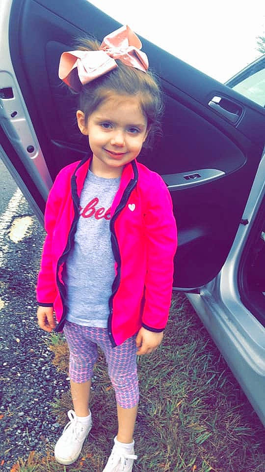 Rayden is registered to the contest to win money with this photo: car, child, child_model, family_car, jacket, joy, long_hair, magenta, outerwear, person, pink, plant, skin, smile, vehicle, vehicle_door