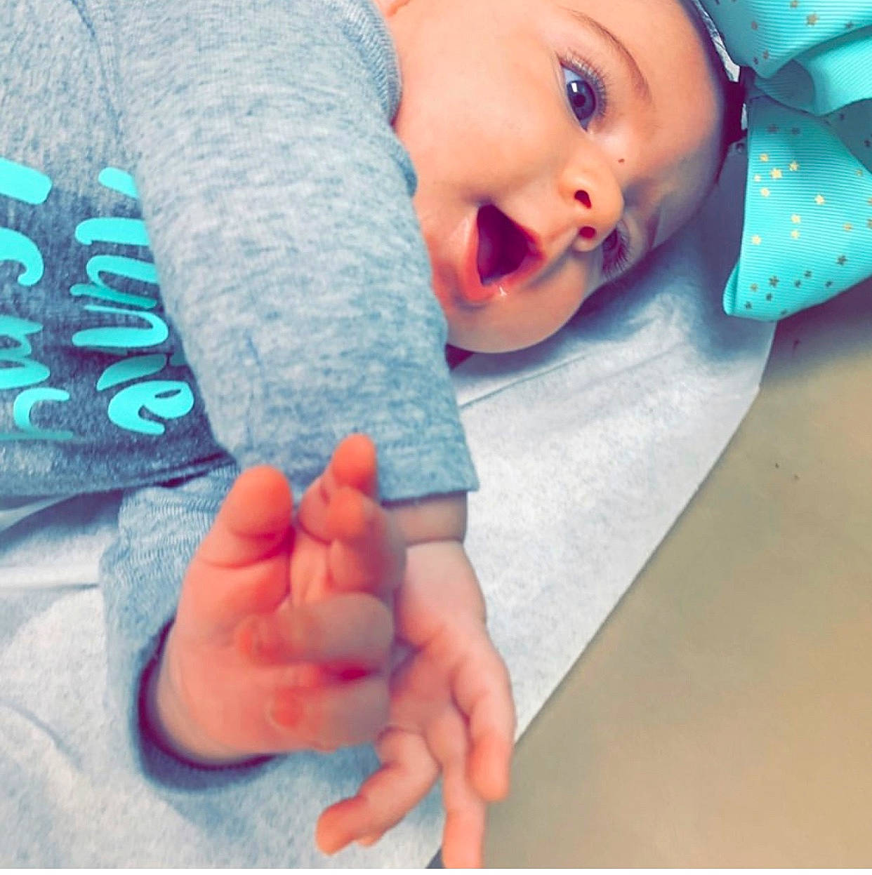 Rylynn is registered to the contest to win money with this photo: arm, baby, baby_sleeping, birth, blue, cheek, child, cloud, finger, gesture, hand, lip, mouth, nail, nose, person, skin, sky, thumb, toddler